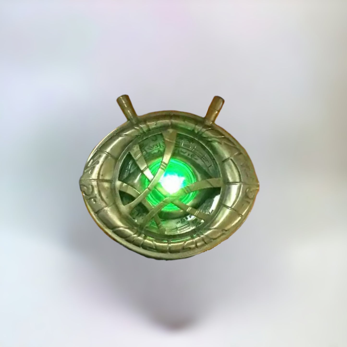 Doctor Strange Eye of Agamotto Necklace pendant front side on a plain white background.