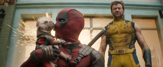Deadpool and Wolverine: Release Date UK & US, Plot, and Everything you Need to Know. Image taken from the Deadpool and Wolverine Trailer showing deapdool kissing his pet and wolverine on the background.