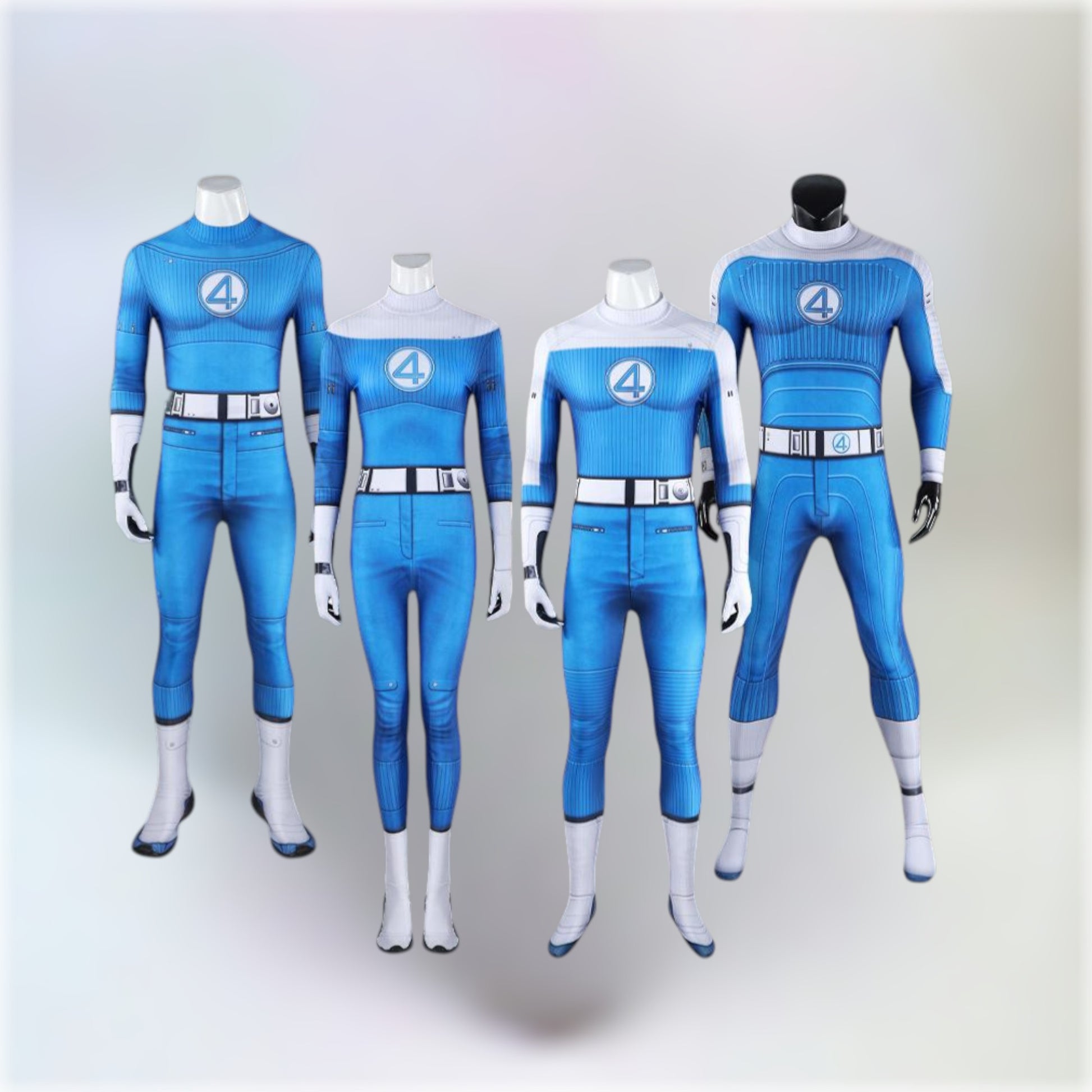 All costumes of the Fantastic Four team displayed on mannequins with a light grey background.