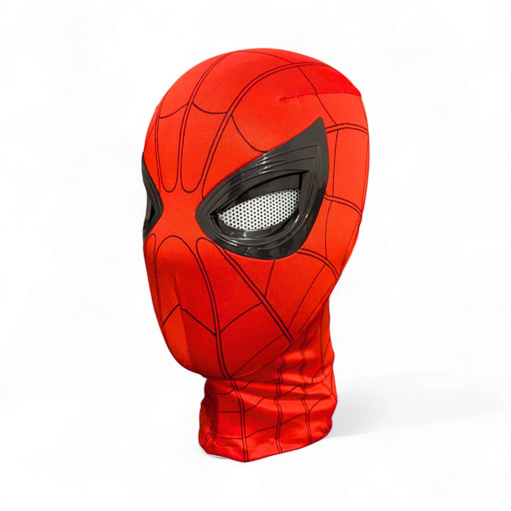 Spiderman mask with blinking movable eyes realistic ring remote control and box on a plain white background.