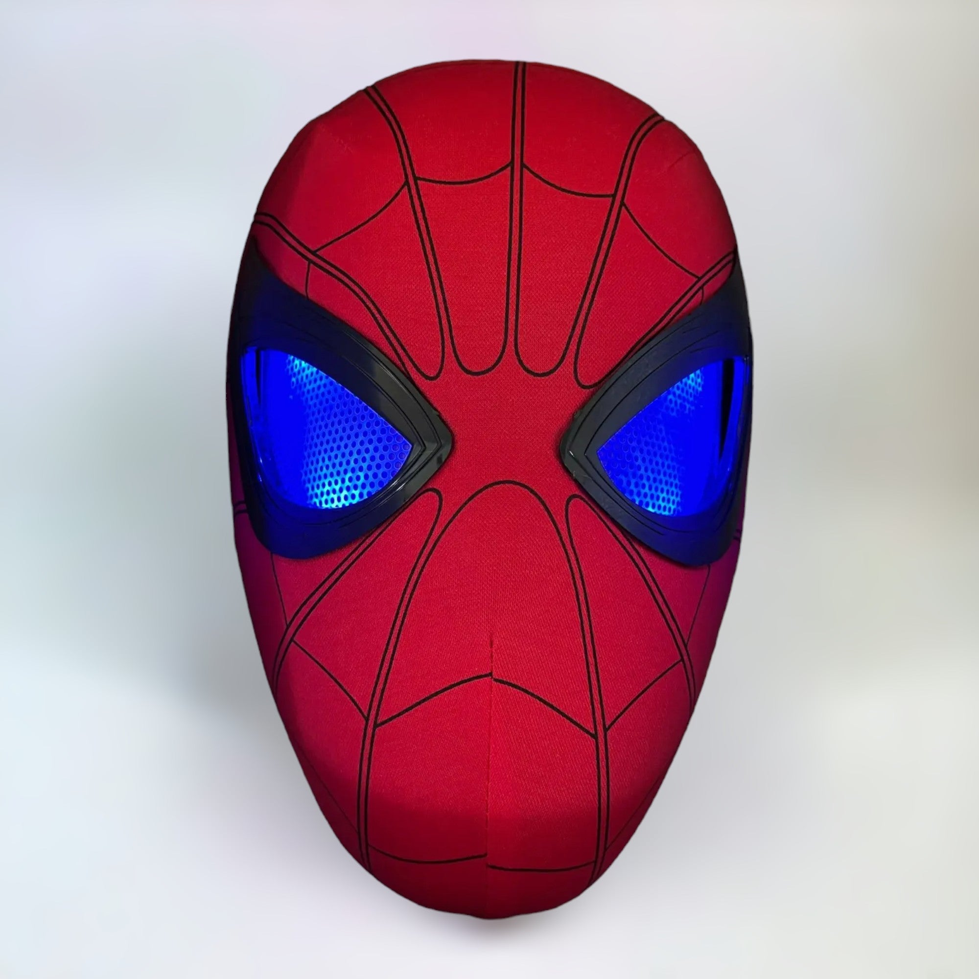 Spiderman mask with blinking movable eyes led lights blue on plain white background.