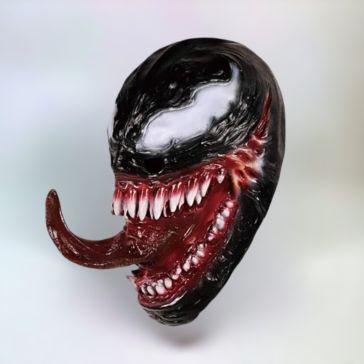 Right side view of Venom mask with sharp teeth visible from the angle.